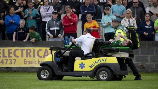 Oran Groarke leaves the field to tremendous applause, after he sustained an accidental ankle injury in the 78th minute. 