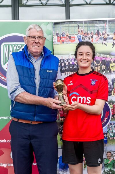 Kiltimagh Knock United's Hana Ueno receives the player of the match award from Martin Walsh. 