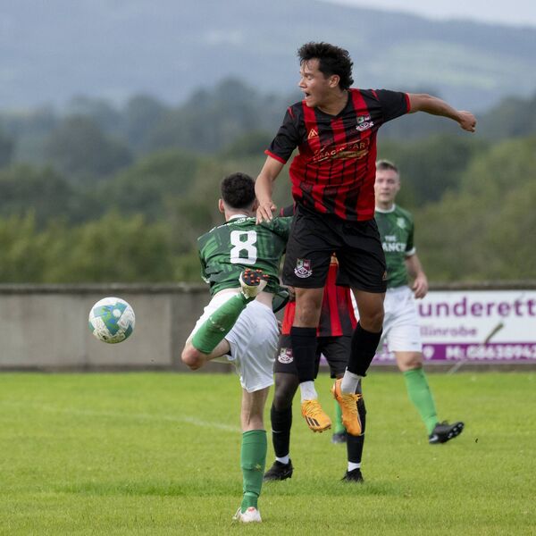 Ballyhaunis Town's Lucas Garcia beats Jason Murphy of Claremorris (wearing 8).  Ballyhaunis Town's Lucas Garcia beats Jason Murphy of Claremorris (wearing 8).