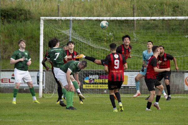 Lucas Garcia, centre, heads clear for Ballyhaunis.  Lucas Garcia, centre, heads clear for Ballyhaunis.