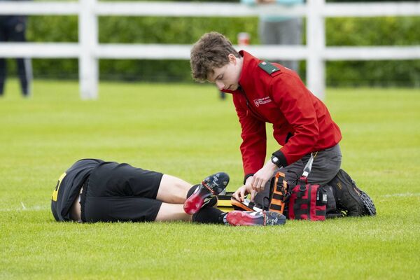 Swinford midfielder Niall Egan receives medical attention during the Mayo Premier Cup Final on Sunday morning. 