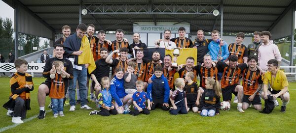 Straide &amp; Foxford United players celebrate their Premier Cup win at Milebush on Sunday. 