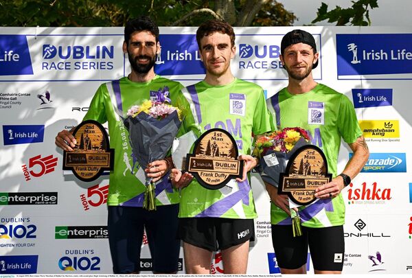 Race winner Pierre Murchan of Dublin City Harriers, centre, with second place Hugh Armstrong of Ballina AC, left, and third place Stephen McAuley of Letterkenny AC, Donegal, on the podium after the Irish Life Dublin Race Series Frank Duffy 10 Mile in Phoenix Park, Dublin.