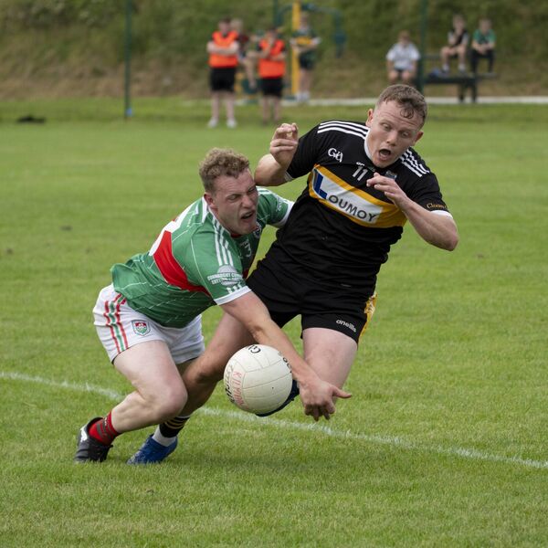 Kilmaine's Evan Heraty tackles Louisburgh's Dylan Prendergast. Picture: John Corless