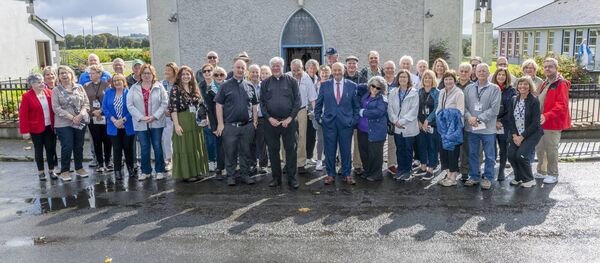 Monsignor Patrick Hambrough and the visiting group outside the local church in Taugheen recently. Picture: John Corless Monsignor Patrick Hambrough and the visiting group outside the local church in Taugheen recently. Picture: John Corless