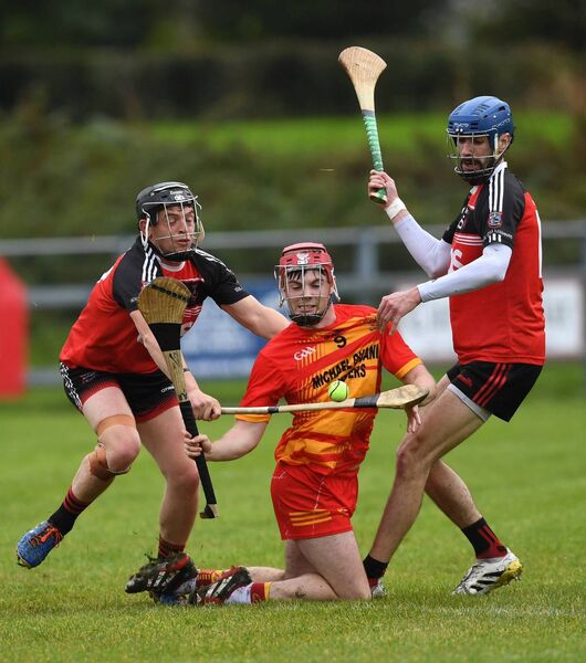 Castlebar's Barry Lane is closely marked by Kieran McDermott and Ryan Kilbane of Ballyhaunis during the Connacht Gold Mayo SHC semi-final at Ballyhaunis last Sunday.	Pictures David Farrell Photography 