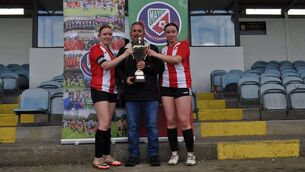<p>Eve Malone, left, and Emily Vahey receive the Mayo U19 Cup from John Noonan, representing the sponsors Hayes Mechanical &amp; Engineering.	Picture: Deirdre Ryan</p>