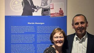 <p>Martin Hennigan, with his wife Therese at the Croke Park display which honours the achievements of the Swinford native.</p>