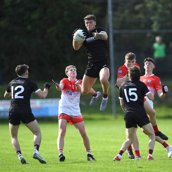 Crossmolina’s Jordan Flynn soars into the air to collect the ball at midfield during the Mayo GAA Connacht Gold SFC quarter-final at St. Tiernan’s Park, Crossmolina, last Sunday. Picture: David Farrell Photography 