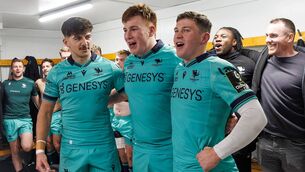 <p>Fiachna Barrett flanked by Chay Mullins</p>