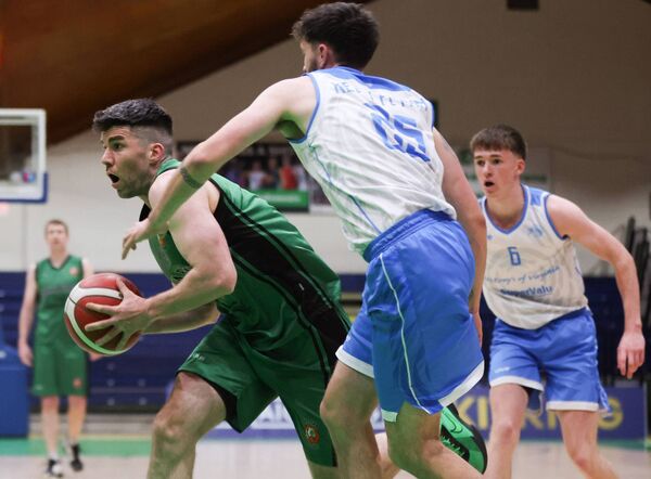  Merry Monk Ballina's Ronan O'Malley is challenged by Alex Kelly Flynn of Cavan Eagles during the Basketball Ireland Men's BIDL Plate Final in Tallaght last April.	Picture: INPHO/Tom Maher