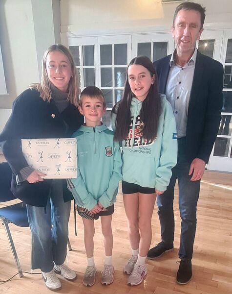 Sarah Healy, left, received a presentation from Moy Valley AC which was made by her relations Cillian and Eve McHale. Also pictured is club chairperson Seán Gallagher. Sarah Healy, left, received a presentation from Moy Valley AC which was made by her relations Cillian and Eve McHale. Also pictured is club chairperson Seán Gallagher.