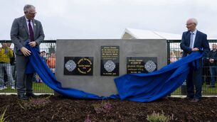 <p> GAA President Jarlath Burns is assisted by club chairperson Gerry King as he unveils the plaques to officially open the new facilities at Gilmartin Park in Kiltimagh last Saturday. 	Picture: John Corless</p>
