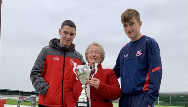 A proud lady, Angela Reilly is pictured with the U15 Division 1 League Cup flanked by her grandson and team Captain, Cillian (right) and her next door neighbour Neil Murphy, the highly talented U15 goalkeeper who saved a penalty. Picture by Tom Quinn. A proud lady, Angela Reilly is pictured with the U15 Division 1 League Cup flanked by her grandson and team Captain, Cillian (right) and her next door neighbour Neil Murphy, the highly talented U15 goalkeeper who saved a penalty. Picture by Tom Quinn.