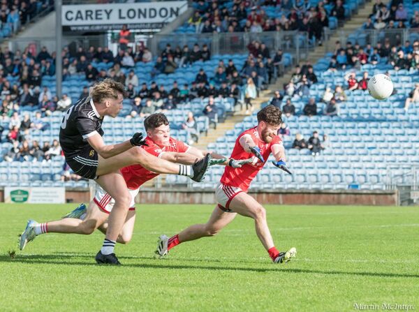 17-year-old substitute Cormac O'Malley kicking one of the five points he scored in a remarkable Player of the Match display, as Cathal Clarke and Oisin McHugh of Moy Davitts do their best to try and block the shot. Picture: Martin McIntyre 17-year-old substitute Cormac O'Malley kicking one of the five points he scored in a remarkable Player of the Match display, as Cathal Clarke and Oisin McHugh of Moy Davitts do their best to try and block the shot. Picture: Martin McIntyre