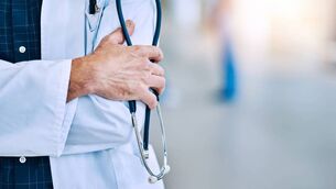 <p>Cropped shot of a doctor holding a stethoscope.</p>