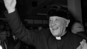 <p>Monsignor James Horan in his distinctive hat on the day the first flight left Knock Airport in October 1985.	Picture: Western People Archives</p>