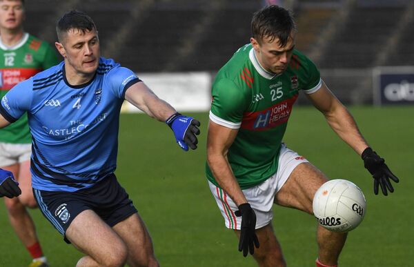 Ballina Stephenites' Luke Doherty slips past Westport’s Brian McDermott at Hastings Insurance MacHale Park last Saturday.	 Picture: David Farrell Photography  Ballina Stephenites' Luke Doherty slips past Westport’s Brian McDermott at Hastings Insurance MacHale Park last Saturday.	 Picture: David Farrell Photography