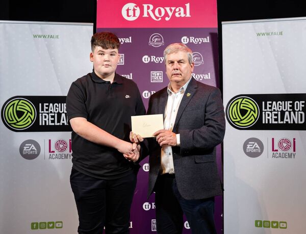 Club photographer Cillian Staunton was presented with a Special Recognition Award from Mayo FC's Gerry Sweeney. Club photographer Cillian Staunton was presented with a Special Recognition Award from Mayo FC's Gerry Sweeney.