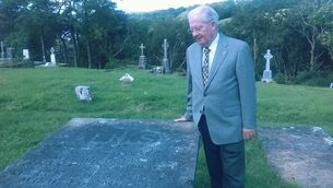 <p>Frank Durcan pictured in 2018 beside the grave of James Faughney in Castlebar Old Cemetery. Faughney was believed to be 120 years old when he died in 1826 and Frank wanted to recognise this unique Castlebar man.</p>