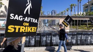 <p>Members of the Hollywood actors SAG-AFTRA union walk a picket line with screenwriters during the actors' strike on July 14, 2023 in Los Angeles, California. 	Picture: David McNew/Getty Images</p>