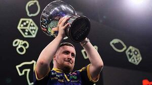 Luke Littler celebrates world number one status by retaining Grand Slam of Darts