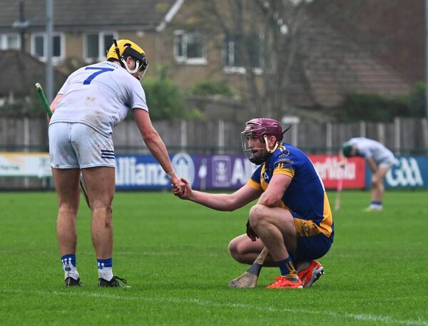 Sean Glynn of St Gabriel's is consoled at the final whistle by Tooreen's David Kenny. Picture: Sheila Fernandes