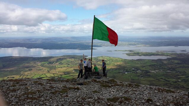 <p>Mayo football fans raise a giant flag on top of majestic Nephin ahead of the All-Ireland Senior Football Final in 2013.</p>