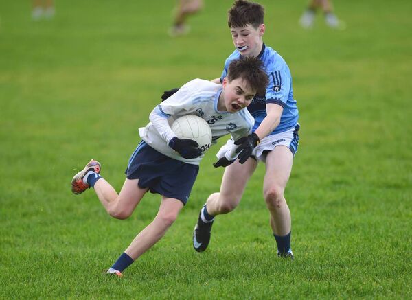 Rice College’s Jamie Holmes get tackled by St Gerald’s Hayden Conroy during the O’Haire Cup.