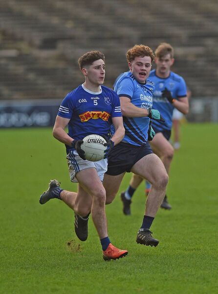 Claremorris defender Paul Gilmore gets past Westport’s Elcmar O’Toole.