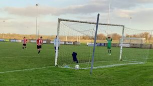 <p>Salthill Devon goalkeeper Arek Mamala can only watch as Jack Keane rolls the ball into the net for the second goal for Ballyglass in the Connacht Cup third round clash in Ballyglass on Saturday. Picture: Tom Quinn</p>
