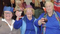 Local Notes: The ladies enjoy Christmas Community Dinner in Kilmovee Community Centre.
