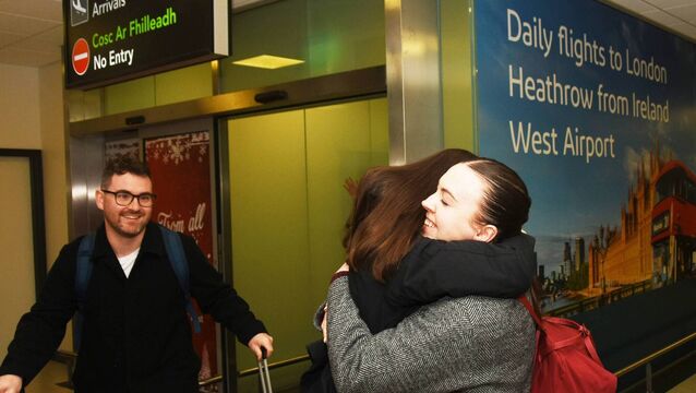 <p>Marie Fitzgibbon from Tuam (middle) greets her sister Emma Fitzgibbon and her fiance Ben Carty from Oxford at Ireland West Airport in Knock last Thursday.	Picture: John O'Grady</p>