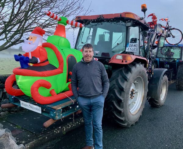 Paul Kilcourse checks on Santa before embarking on the Ballintubber tractor run on December 21st. The event was a huge success with scores of magnificently illuminated machines patrolling the parish.	 Picture: Tom Quinn