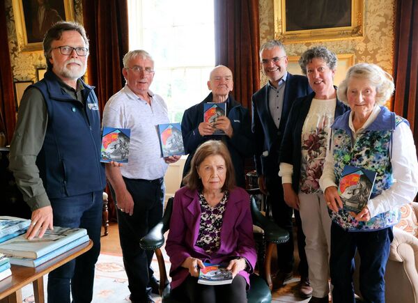 At the official launch of the Táin Bó Fliodhaise Cattle Raid of Mayo Heritage Trail were Denis Strong (NPWS), Uinsíonn Mac Graith, Micheál Ó Seighin, Minister Dara Calleary, Treasa Ní Ghearraigh, Carmel Hughes and Pearl King (seated) (photo: Máire Ní Fhalliún)