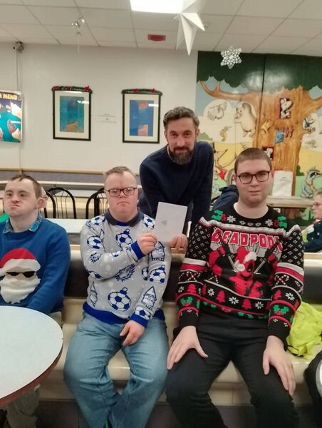 On behalf of Ballina Tennis Club, coach Artur Jastrzebsk presented a cheque to James Gough, Killian Corr and Aidan Larkin, who are part of the Connacht Special Olympics Team for the 2026 Special Olympics Ireland Games. Aidan and Killian are playing basketball while James is playing badminton. Pictured from left are James Gough, Killian Corr and Aidan Larkin, with BTC coach Artur Jastrzebski.