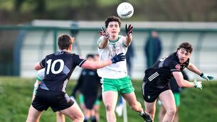<p>London's Shay Rafter passes the ball beyond Sligo's Ronan Niland during last Sunday's FBD Connacht SFL encounter at the Connacht GAA Centre of Excellence.	Picture: INPHO/Dan Clohessy</p>