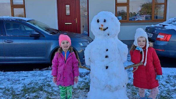 Alison and Ciara Casey, from Carracastle, with their snowman.