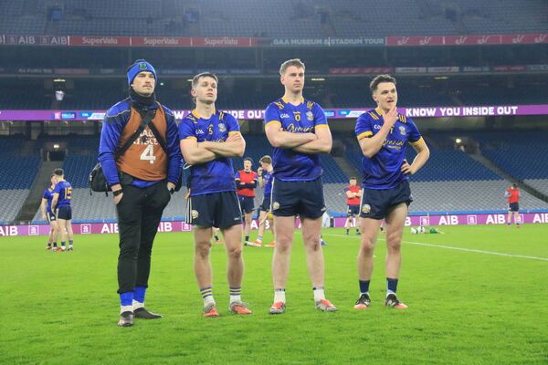 Easkey players Donall Hanley, Eanna Moylan and Eoghain Rua McGowan watch the presentation of the All-Ireland trophy to Kilbrittain. Picture: Lauren Fitzgerald
