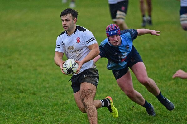 Ballinrobe's Dylan Keane takes on the Castlebar defence.	Picture: Conor McKeown