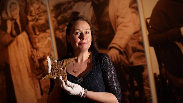 Keeper of the Irish Folklife Division of the National Museum of Ireland Clodagh Doyle with one of the Museum's St Brigid's Day crosses. <p>Keeper of the Irish Folklife Division of the National Museum of Ireland Clodagh Doyle with one of the Museum's St Brigid's Day crosses.</p>