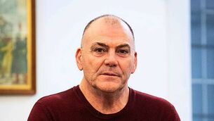 Gardaí investigating after masked armed gang caught setting car alight and damaging house in Limerick