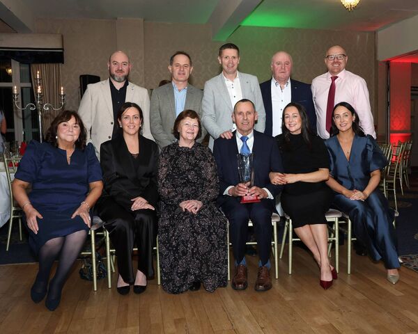 Hall of Fame recipient Martin Hennigan pictured with his family and also special guest Tomás Ó Sé and Western People commercial manager Aidan McNulty, third and first from right on the back row.