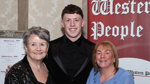 <p>Mark Conroy from Ballina with his grandmothers Mary Whittington and Rose Conroy. Mark was the recipient of the swimming award at the Mayo Sports Stars gala presentation banquet in Breaffy House Hotel, Castlebar.	 Picture: Michael Donnelly</p>