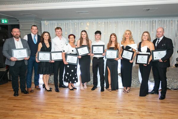 The presentation of certificates on behalf of Tullaghan Bay's half marathon rowers.