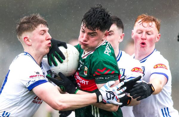 Mayo's Bob Tuohy is tackled by Thomas Hughes, Micheal McCarville and Ryan O'Toole of Monaghan.