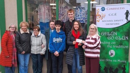 Local Notes: Michael Davitt CCE Swinford present cheque to Swinford Hospice Shop.