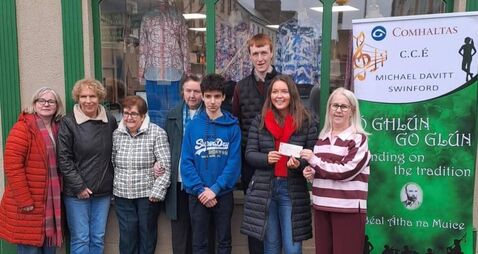 Local Notes: Michael Davitt CCE Swinford present cheque to Swinford Hospice Shop.