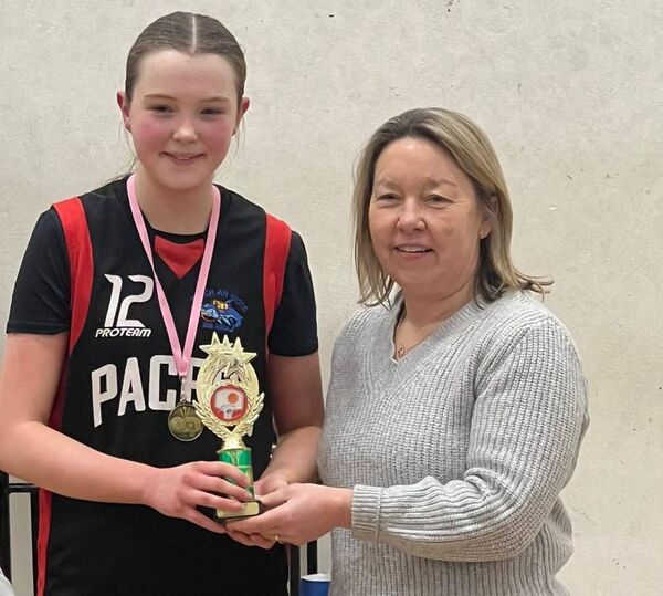 MVP award winner Emma Devaney accepts her trophy from Trisha Battle, Mayo Basketball Board fixtures secretary.