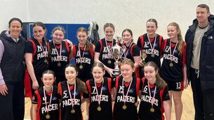 <p>Ballina Pacers, under-14 cup champions, pictured with coaches Suzanne McDonagh and Ronan McGarrity.</p>